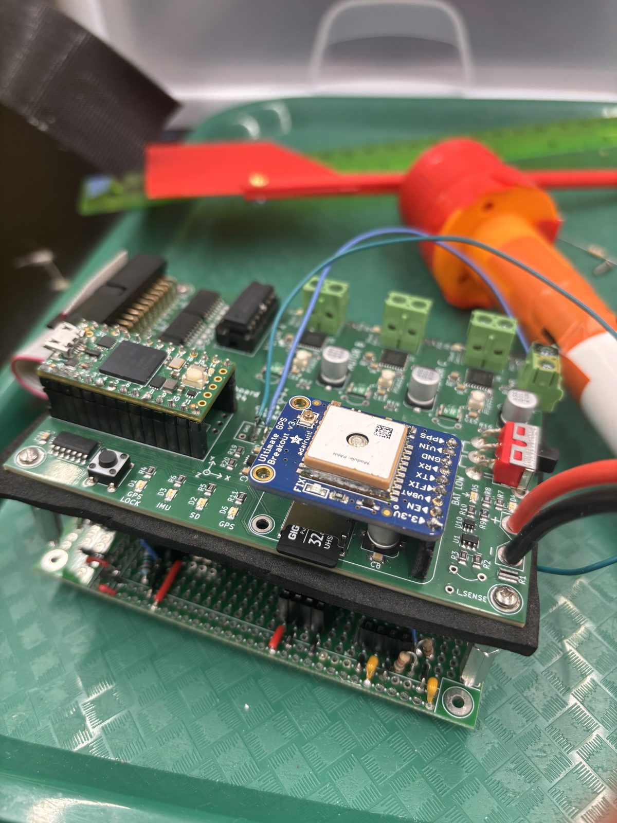The Teensy board stacked on the sensor protoboard inside the enclosure