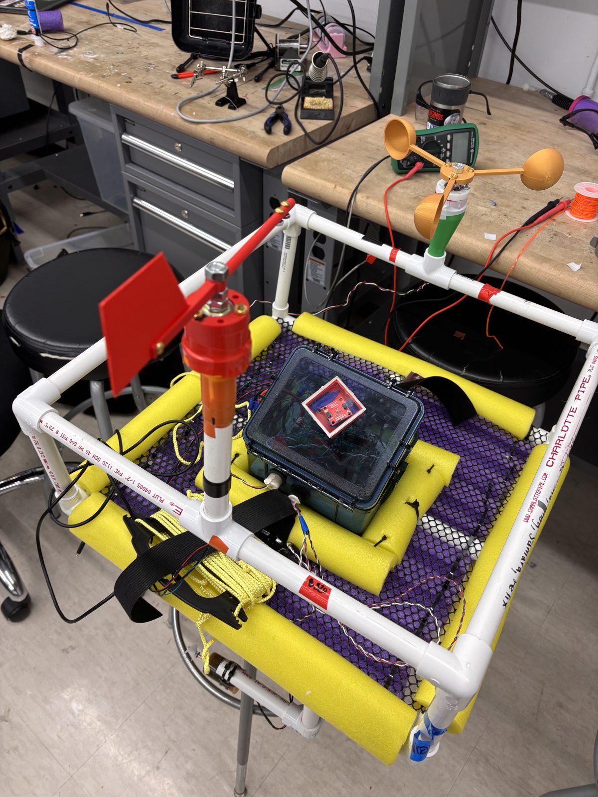 The wind vane and cup anemometer mounted above the sealed electronics box on the assembled ASV